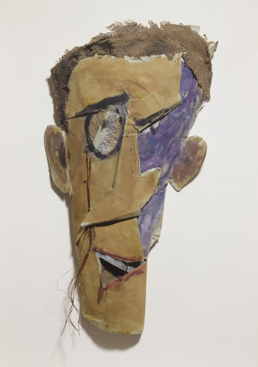 Marcel Janco, Portrait de Tzara [Πορτρέτο του Τζαρά], 1919, χαρτόνι, λινάτσα, μελάνι και γκουάς, Centre Pompidou, Παρίσι. Η μάσκα-πορτρέτο, με το επιμηκυμένο πρόσωπο και το ζωγραφισμένο μονόκλ του Tristan Tzara, συγγενεύει με τις μάσκες από ευτελή υλικά που έφτιαχνε ο Janco για τις ντανταϊστικές βραδιές της Ζυρίχης. Μαθήτριες της σχολής του [[#Rudolf von Laban [Ρούντολφ φον Λάμπαν]#]] τις φόρεσαν στην τελευταία βραδιά, τον Απρίλιο του 1919.